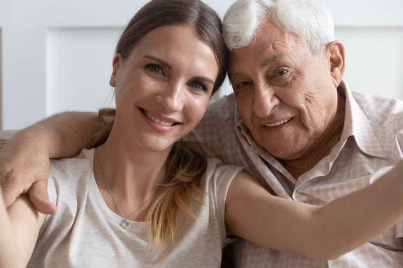 happy young woman with old man